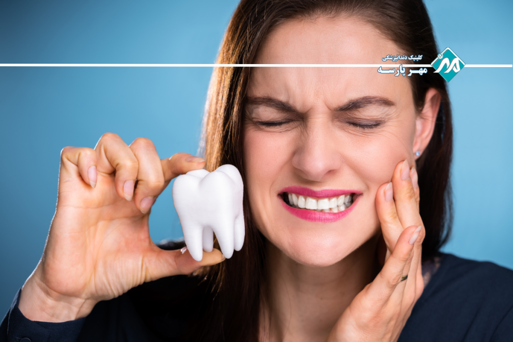 علت درد زیر روکش دندان چیست؟